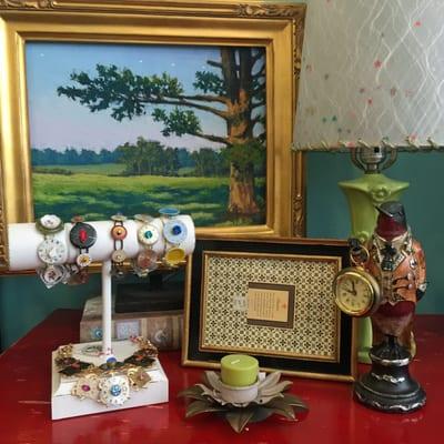 Gallery vignette showcasing one of Annette's pastel paintings and Diana's hand made jewelry.