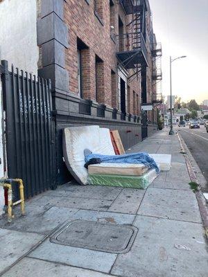 The street where the mattresses stayed for another week with homeless people