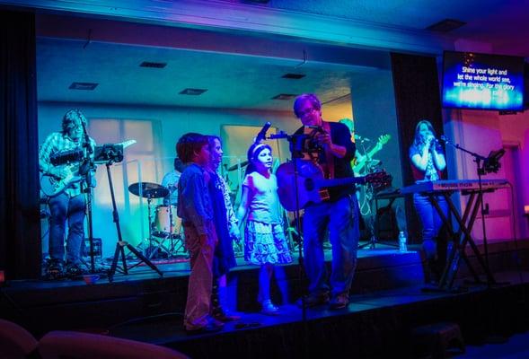 some of the children singing with the band