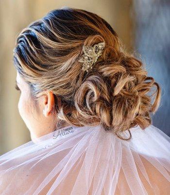 Loose low updo for Bride