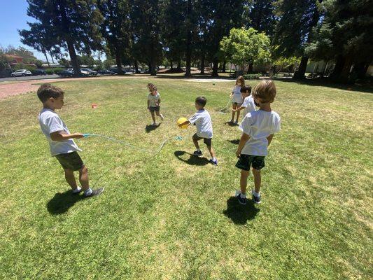 Kicking around a ball outside in the sunshine