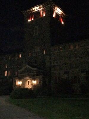 The Society Building tower at night.