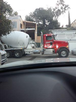 This is the truck blocking our driveway. We honked for 5 mins and no one came to move the truck.