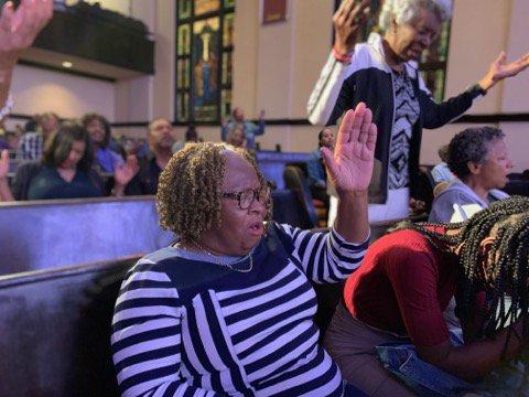 Members praying at Corporate Prayer Night