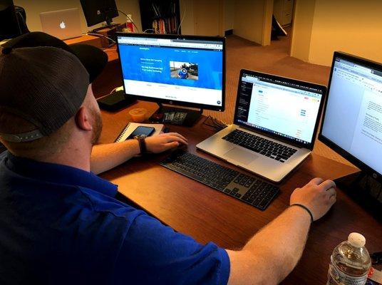 Spencer Teuscher at his desk working.