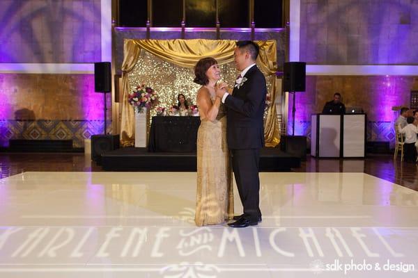 Line 204 - Sweetheart table platform with black carpeting, pipe & draping with gold backdrop