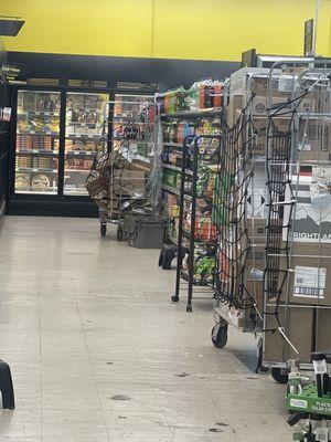 Boxes in the way of every aisle and dirty floors