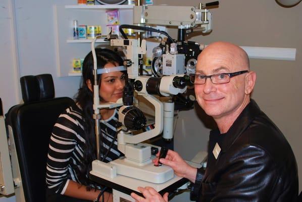 Dr. Berliner at new photo slit lamp biomicroscope.