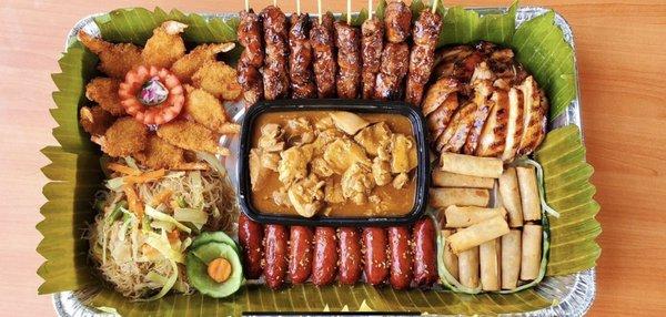 Boodle Fight  Lumpiang Shanghai Butterfly Shrimp Pork BBQ Skewers Chicken Teriyaki Pancit Bihon Beef Caldereta a la Carte Pork Longanisa