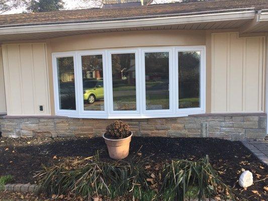 Front bow window and new siding.