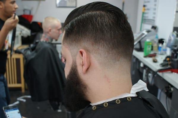 Low fade with a combover by Vic