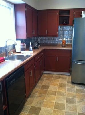 A beautifully painted kitchen cabinet renovation