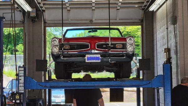 1966 Pontiac GTO on alignment rack at One Stop Automotive.