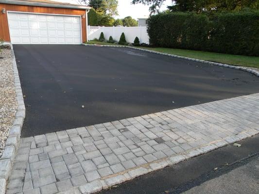 Asphalt driveway with paver apron.