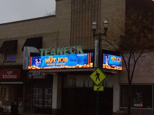 Restored 1937 movie theatre marquee with dynamic LED panels replacing the old changeable letter light boards.