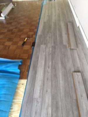 Water resistant laminate flooring installation.