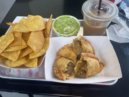 Beef and cheese, eggplant empanadas guacamole and chips