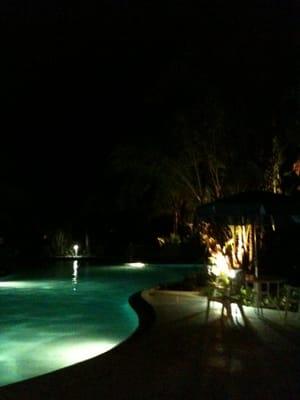 One of the two pools at night.