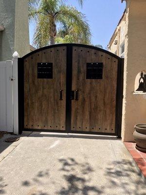 Beautiful wrought iron door with wood inserts. Call us now for the best prices in la county.