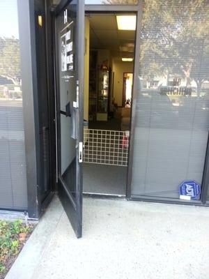 Front door with screen blocking pathway. They do not have any pets or children there. Disabled persons beware!