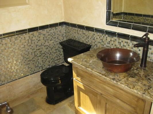 Black Commode and Tiled Wall