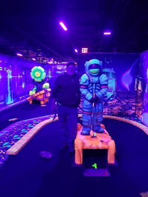 The props are as big as me at glow golf