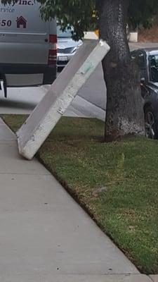 Typical...discarded furniture remains in front of the building for weeks!!