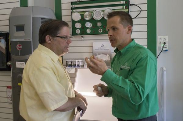 Ellicott City location owner, Bryan Pax, explains LED lighting to a customer.