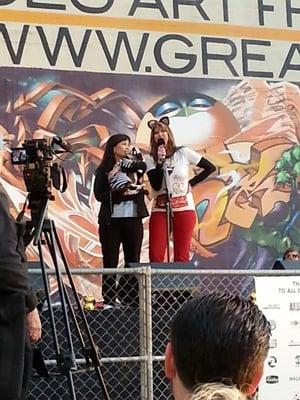 Dusty the Klepto Kitty w/ his human Jean Chu, being interviewed onstage at  OakCatVidFest2013 by emcee Charly Kayle of 96 5 KOIT