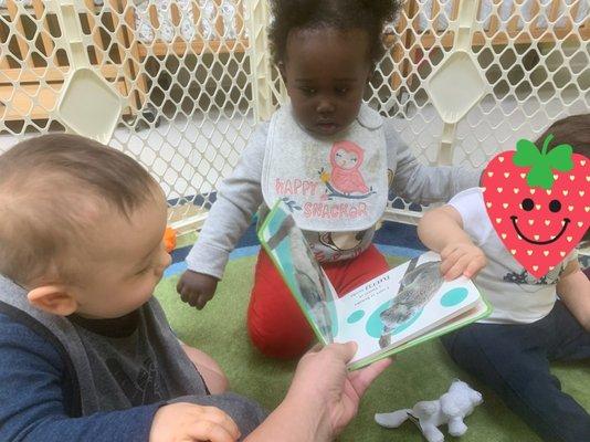 Story time with our babies in The Lullabys Room