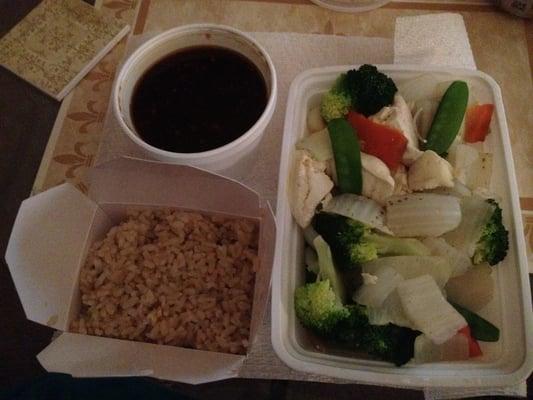 Steamed veggies and tofu with garlic sauce. Yum. Brown rice no extra charge