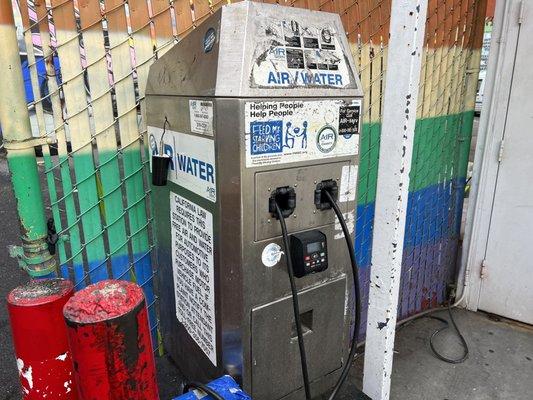 air/water machine at the gas station with card swipe option.