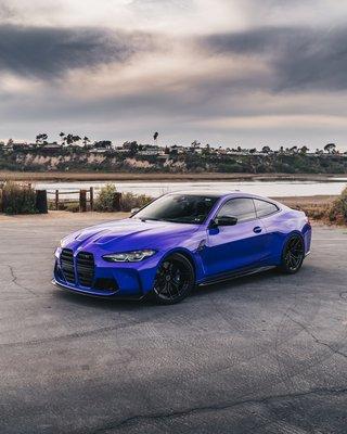 BMW M3 Competition wrapped in CYS Gloss Neon Purple.