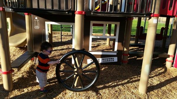 This wagon wheel doesn't move. Cute theme but very small playground.