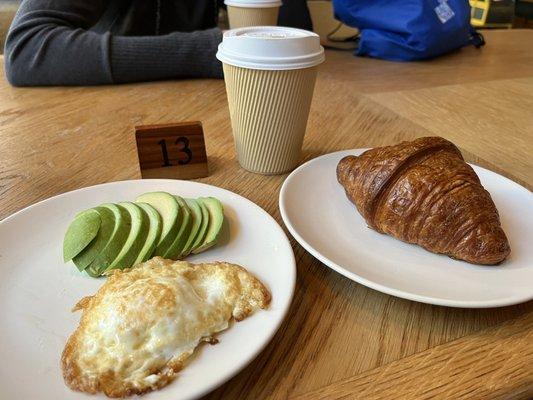 A la carte croissant, fried egg and avocado