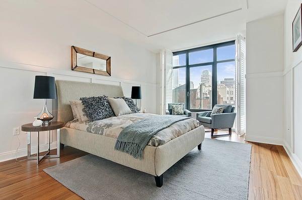 Cozy bedroom staging with a view.