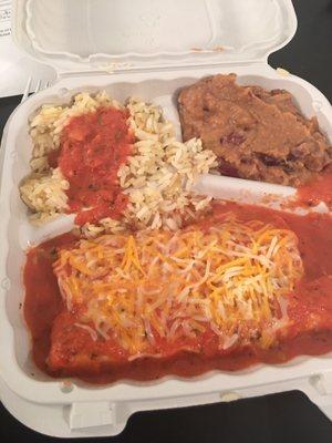 Enchiladas with refried beans and rice topped with salsa. Unbelievably good!