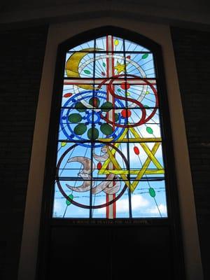 The House of Prayer Window contains symbols of the world's major religions.