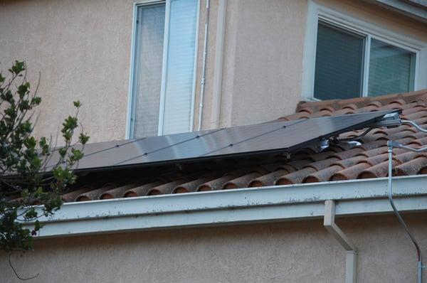 Solar panels on clay tile roof in Burlingame.