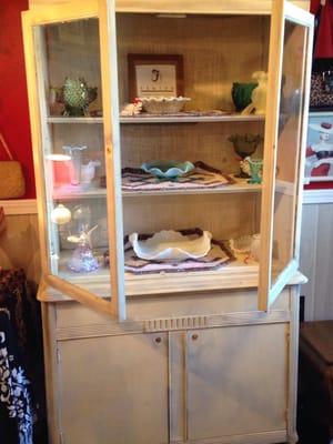 Primitive hutch filled with Fenton and other glassware