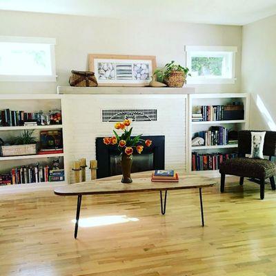 Custom reclaimed beam mantle and custom bookshelves