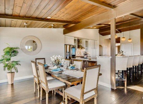 Luxury dining -  staged home in San Diego CA is on one level with views straight to the ocean! Beamed ceilings and hard wood throughout!