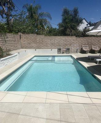 Pool with spa, Baja shelf, and bench along side of pool