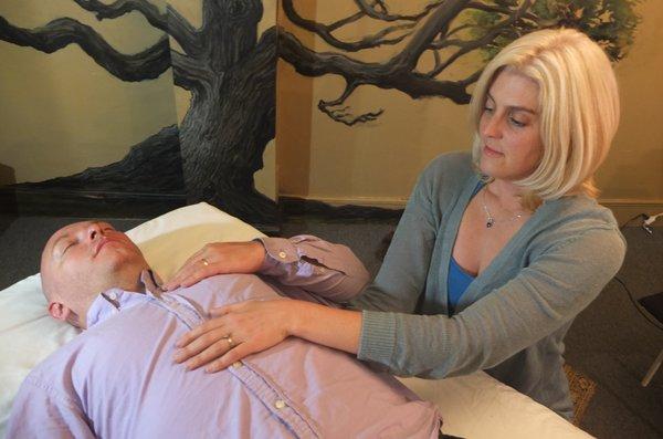 Craniosacral hold on the breathing diaphragm opens the chest and the area around the heart, improving breathing and releasing tension.