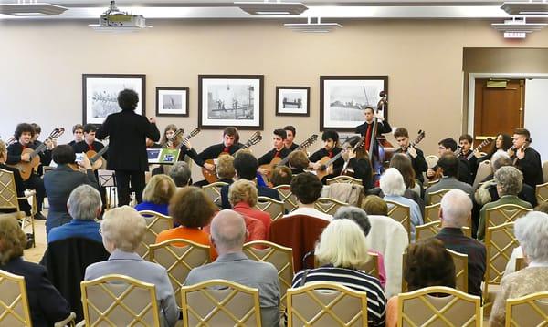 A performance at The Amsterdam at Harborside by the Academia de Musica de Vilar do Paraiso Guitar Orchestra conducted by Augusto Pacheo