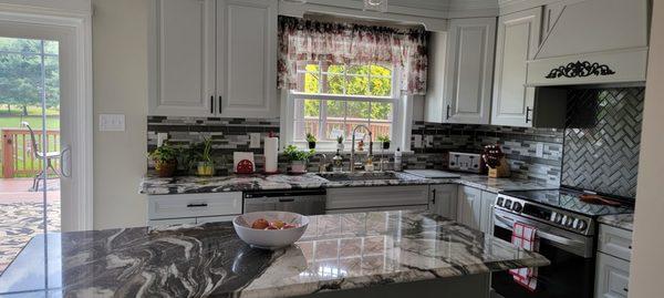 Recent kitchen remodel: Granite countertop, Diamond grey painted cabinets, backsplash tiles