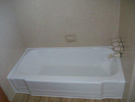 Porcelain tub & Tile enclosure (after) Tub reglazed in glossy white. Tile enclosure in almond speckle finish