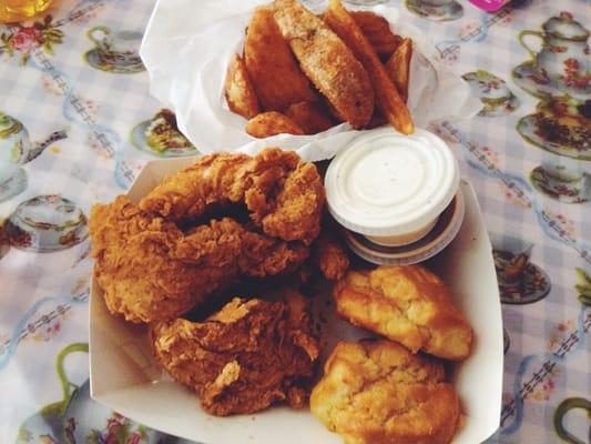 Cajun tenders, Potato Wedges, Biscuits & sides of ranch & BBQ sauce! My fav meal!