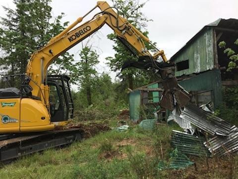 Taking down an old building to prep for a new home.