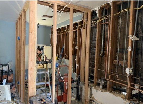 Construction area/progress photo of the new bathroom and laundry room.